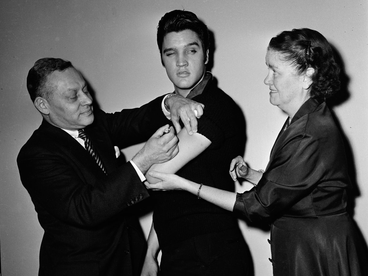 Elvis Presley gets vaccinated behind the scenes of the Ed Sullivan Show in New York City in 1956 (CBS / Getty Images Archive)