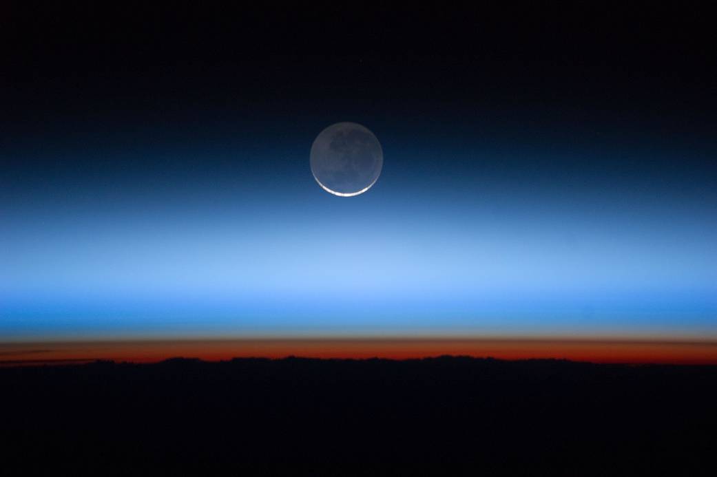 Earth's atmospheric layers: troposphere (orange-red) and stratosphere (blue) as viewed from the ISS. (NASA/JSC Gateway to Astronaut Photography of Earth)
