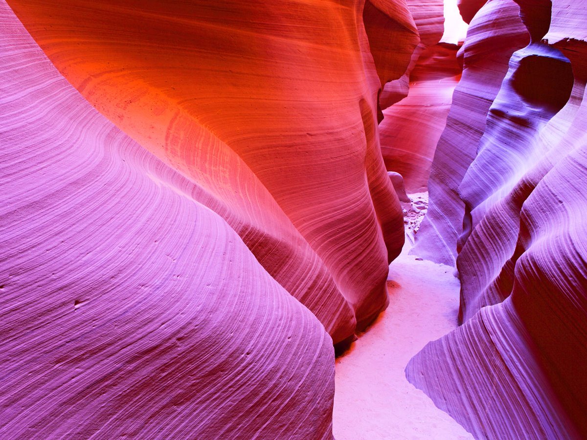 antelope-canyon-located-near-page-arizona-is-the-most-photographed-canyon-in-the-american-southwest-travelers-flock-here-to-capture-its-masterpiece-of-colors-while-admiring-its-smooth-wave-like-texture