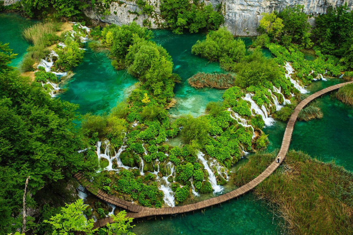 croatias-plitvice-lakes-national-park-is-both-one-of-southeast-europes-oldest-parks-and-croatias-largest-with-16-interlinked-lakes-between-mala-kapela-mountain-and-pljeivica-mountain-the-lakes-are-surrounded-by-lush-forests-and-waterfalls-w