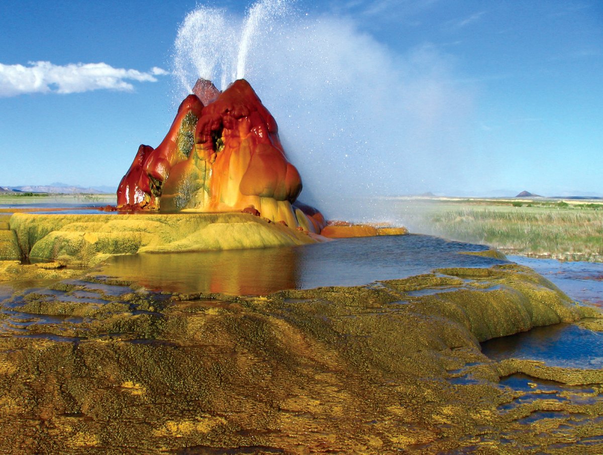 nevadas-fly-geyser-located-in-washoe-county-was-created-through-accidental-well-drilling-in-1916-in-the-1960s-the-water-began-escaping-from-the-drilled-location-creating-the-geyser-that-is-known-for-its-stunning-changing-colors