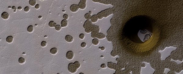 NASA couldn't explain what made this strange, deep hole on Mars