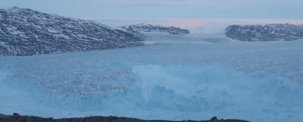This video of a massive iceberg breaking off Greenland is relaxing and scary all at once