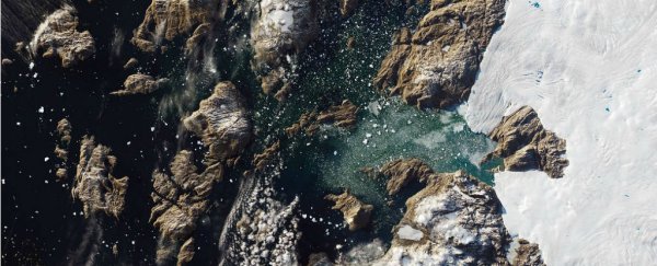 See if You Can Spot That Iceberg Towering Over a Greenland Village in This NASA Satellite Shot