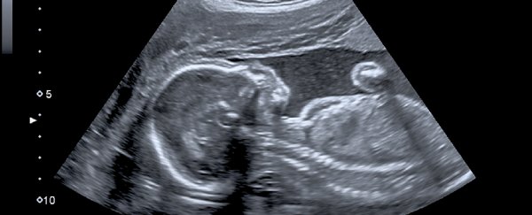 In a UK first, two babies have received spinal surgery while still in the womb