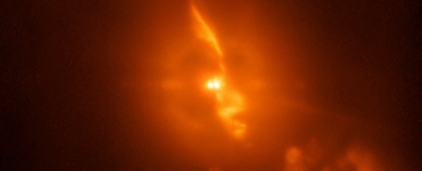 This breathtaking image is a real photo of two stars destroying each other