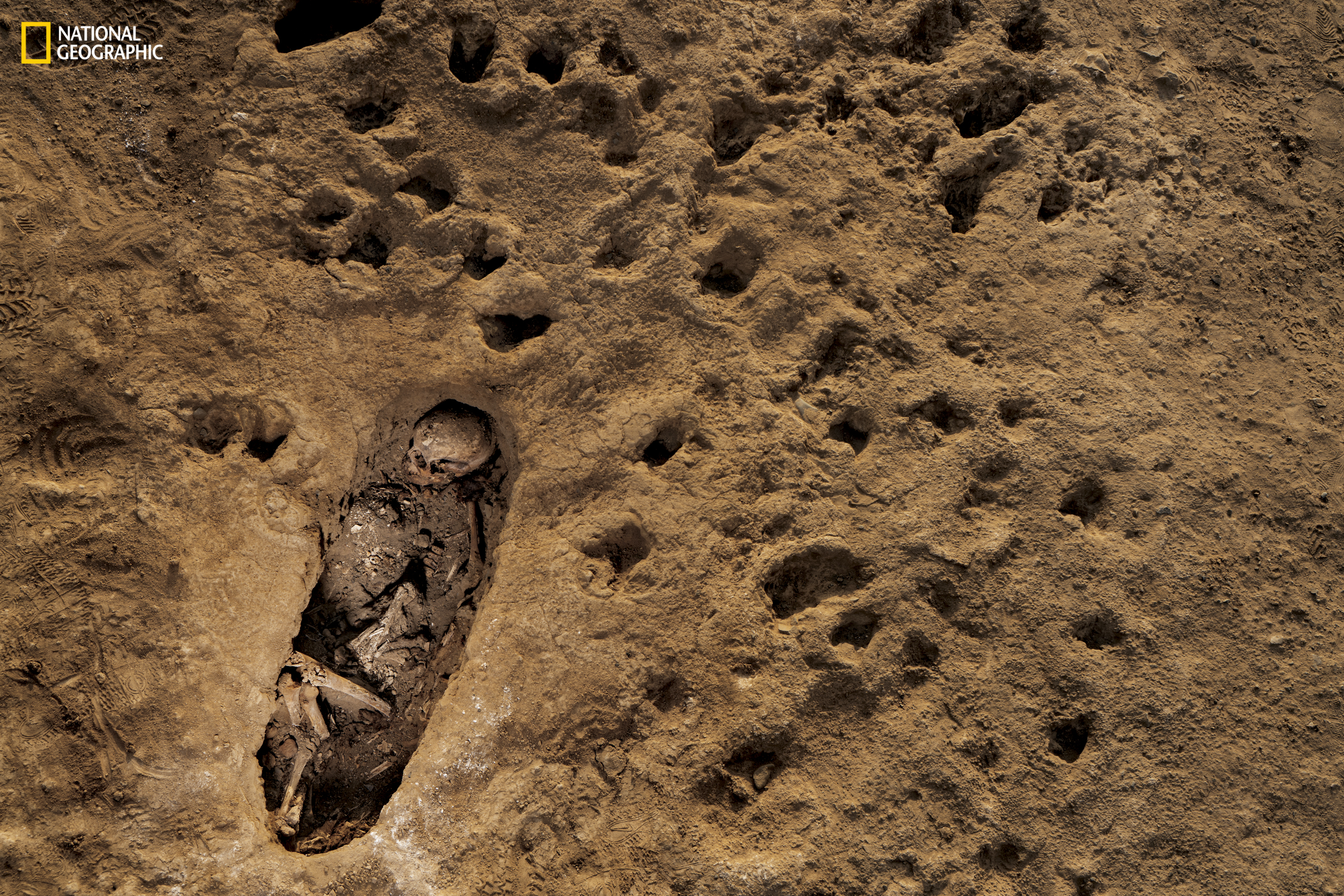 small child in grave hoof marks