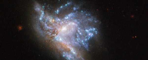 NASA has released a breathtaking new Hubble image of two galaxies smashing