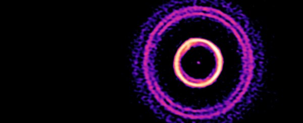 A baby planet is sculpting strange patterns in the dust around its young star