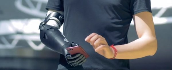 This new mind-controlled robot arm works without a brain implant