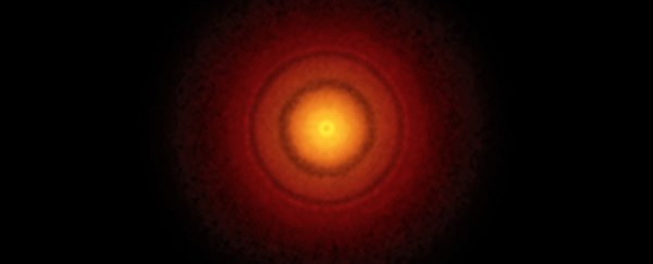 This massive clump of dust could be an early planet, and the scale is mind-blowingly huge