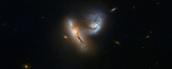 Hubble has caught a stunning image of two smooshing galaxies