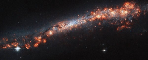 Gloriously deceptive Hubble photo shows what spiral galaxies look like from the side