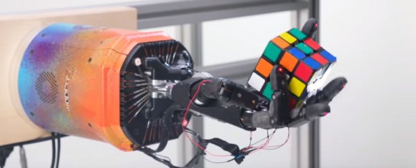 We can't stop watching this robot hand seamlessly solve a Rubik's cube