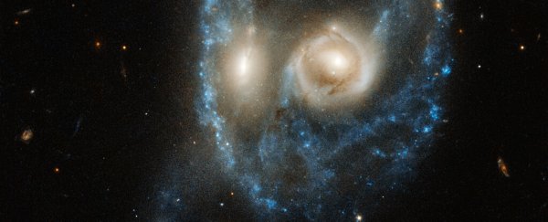 Hubble catches a giant spooky face staring at us from deep within the cosmos
