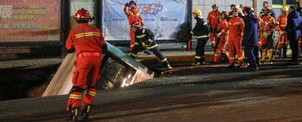 Giant sinkhole swallows an entire bus in China as people run for their lives