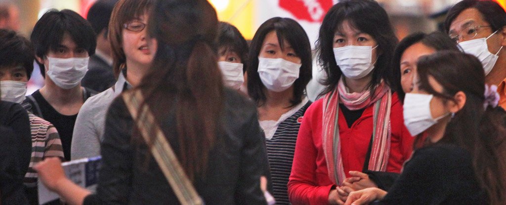 Passengers wear face masks at Beijing Capital International Airport in 2009. 