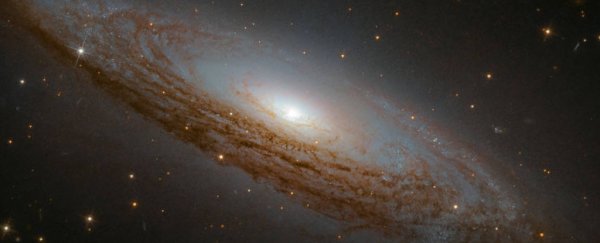 Awe-inspiring new Hubble photo shows a nearby active galaxy, and we suddenly feel tiny