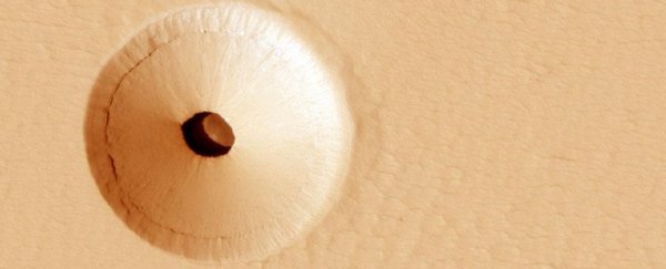 What is the deal with this weird hole on Mars?