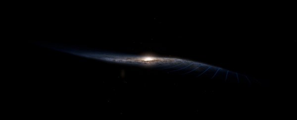 The Milky Way Is Warped, And It May Be The Legacy of an Ongoing Galactic Collision