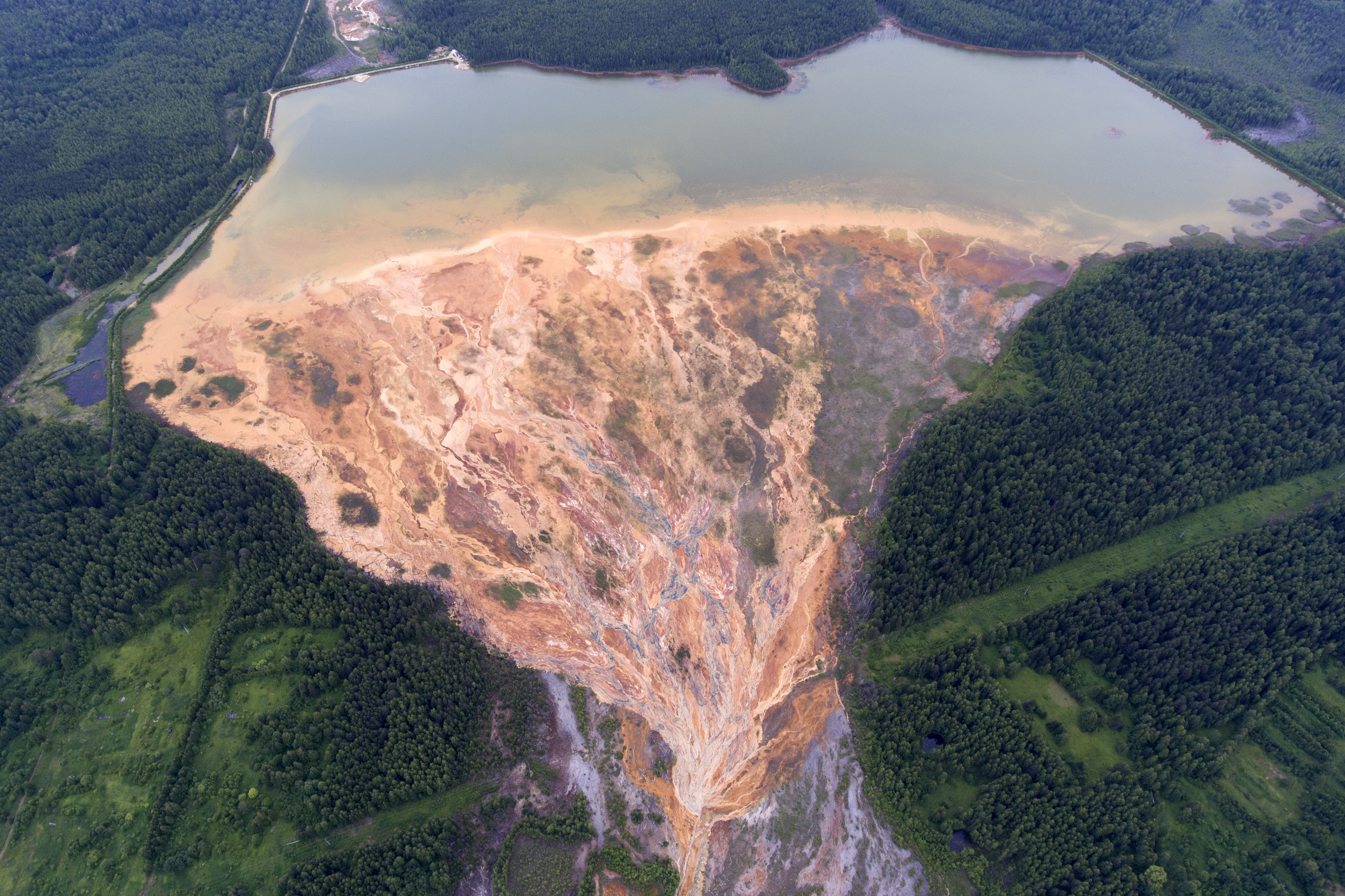 Chilling Images Reveal Acidic Orange Streams Near an Abandoned Mine in Russia