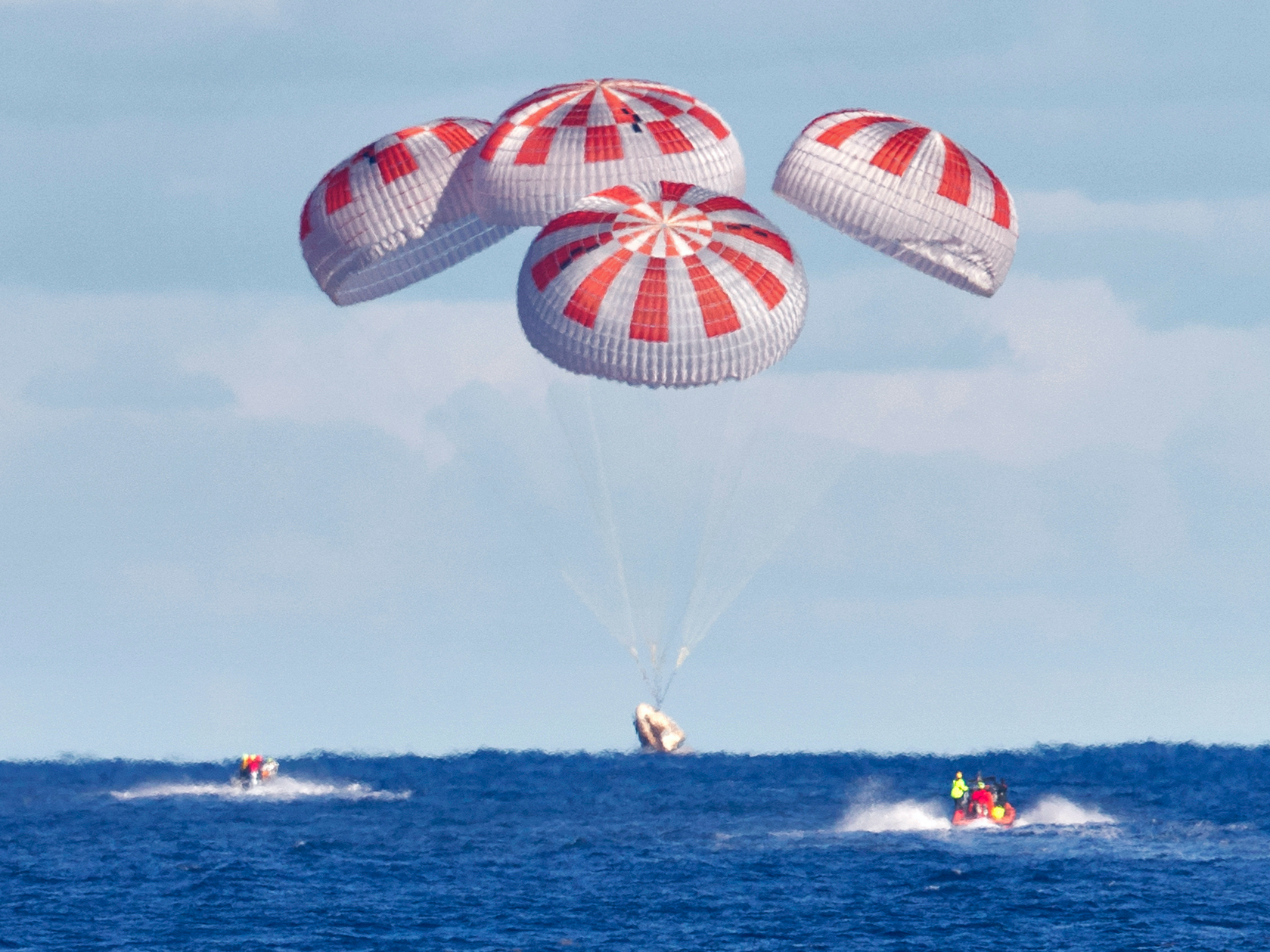 SpaceX's Crew Dragon uses four parachutes for a splashdown, March 2019. (Cory Huston/NASA)