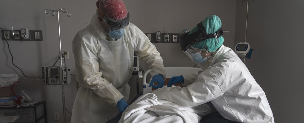 Medical staff with a deceased patient in Houston, June 30. 