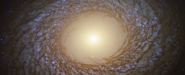 Hubble captures photo of a stunning 'fluffy' galaxy with an oddly empty centre