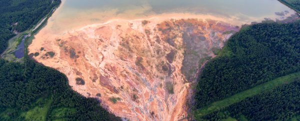 Chilling images reveal acidic orange streams near an abandoned mine in Russia