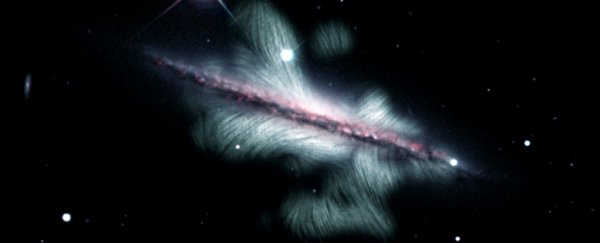 Breathtaking image reveals the colossal magnetic field of a distant spiral galaxy