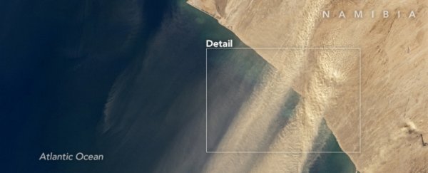 Satellites capture a massive dust storm in Namibia streaming over the Atlantic Ocean