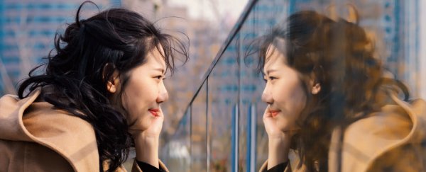 Why do mirrors flip things horizontally but not vertically? Here's the physics