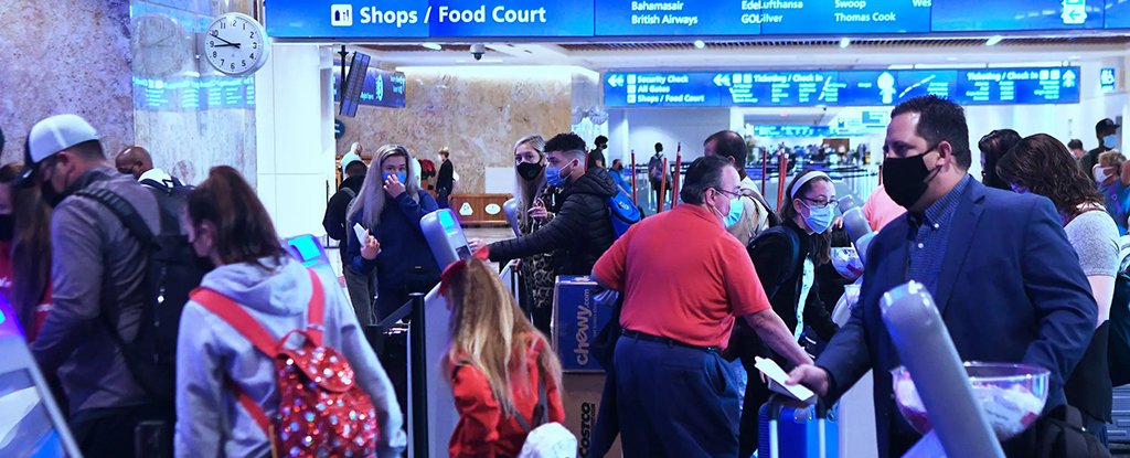 People arrive at Orlando International Airport on 25 November 2020. 