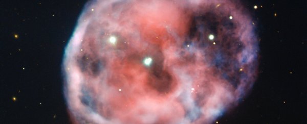 This stunning nebula contains a unique scene – two stars orbited by a third