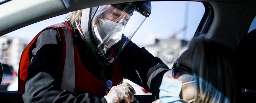 A nurse administers a vaccine on 30 January 2021 in Denver, Colorado. 