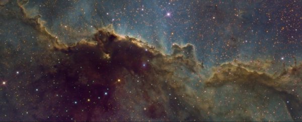 Scientists are inching closer to figuring out how heavy dark matter really is