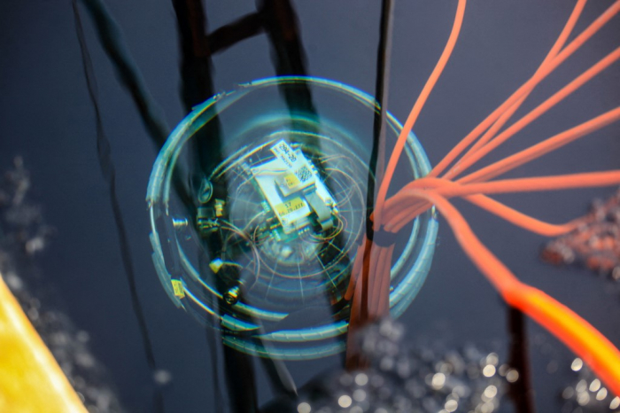 Baikal Gigaton Volume Detector being lowered into the water. (Kirill Shipitsin/Sputnik Kirill Shipitsin/Sputnik/AFP)