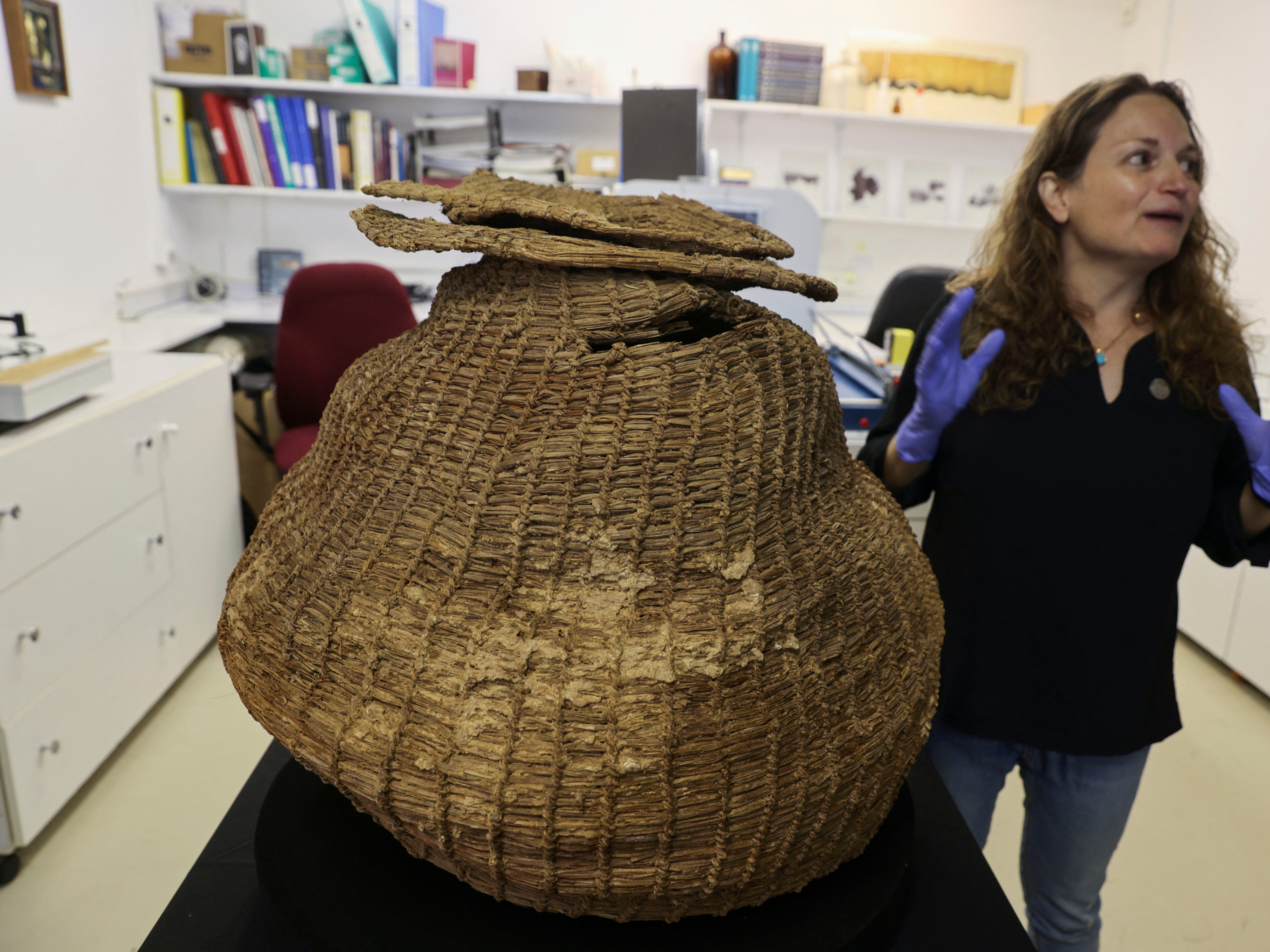 Archaeologist Naama Sukenik presenting the world's oldest basket. (Menahem Kahana/AFP/Getty Images)