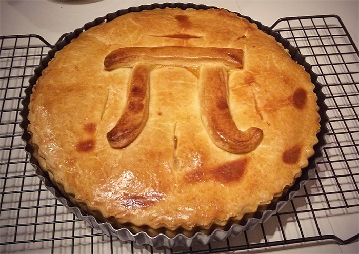 A baked pie with the pi symbol on top