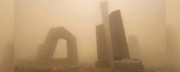 Record-breaking sandstorm chokes Beijing in a surreal veil of orange dust
