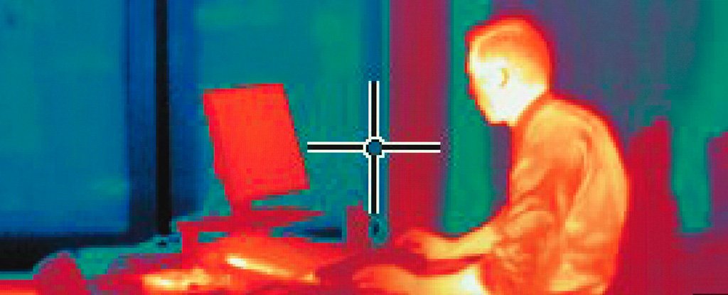 Human under infrared heat camera. 
