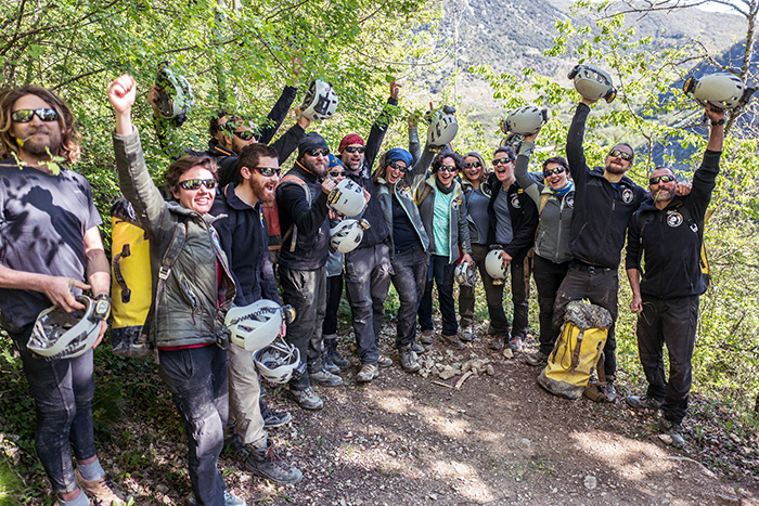 volunteers celebrating after exiting the cave getty