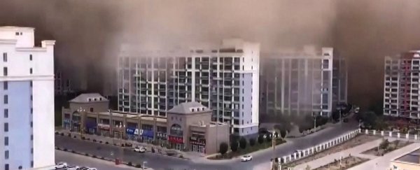 Stunning footage shows giant 100-meter-high sandstorm swallowing city in China