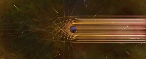 An illustration of photons veering around a black hole.
