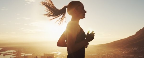 Person running in sun flare