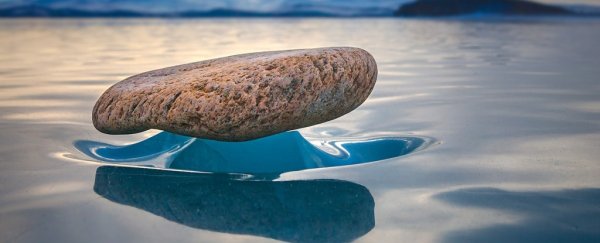 The eerie perfection of 'zen stones': how rocks maintain balance on pillars of ice