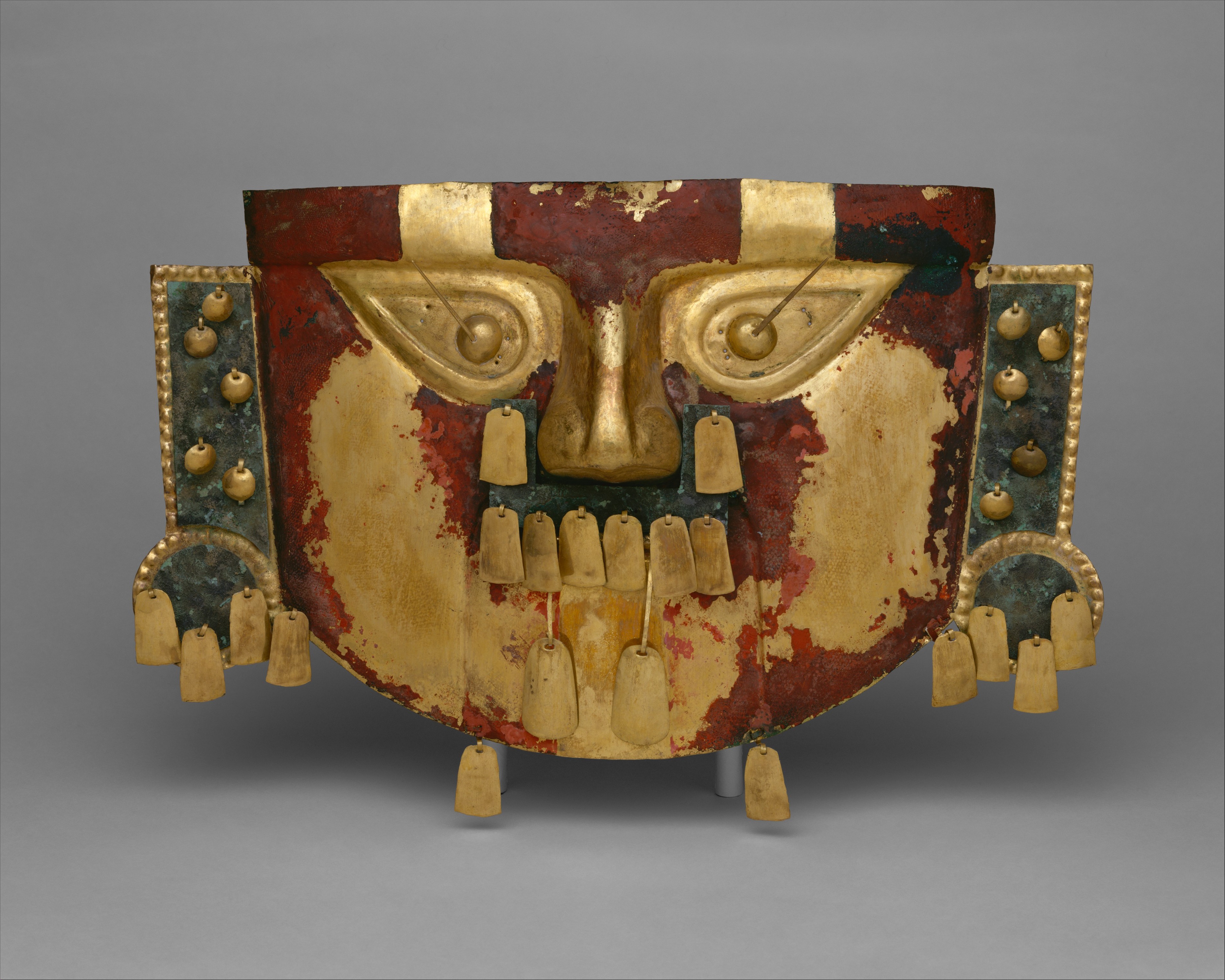 Another example of a Sicán funerary mask painted red. (The Met Museum)