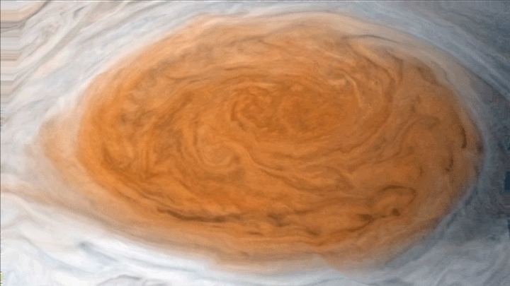 An animation of clouds swirling around it Jupiter's red spot