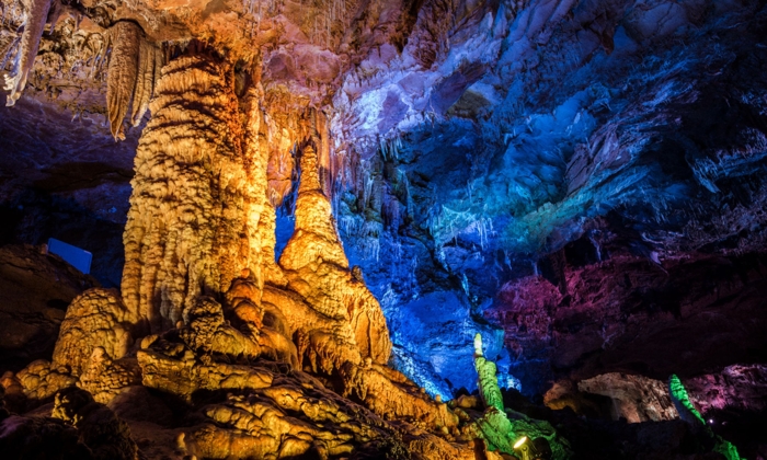 colorful illuminated talagmites in cellar