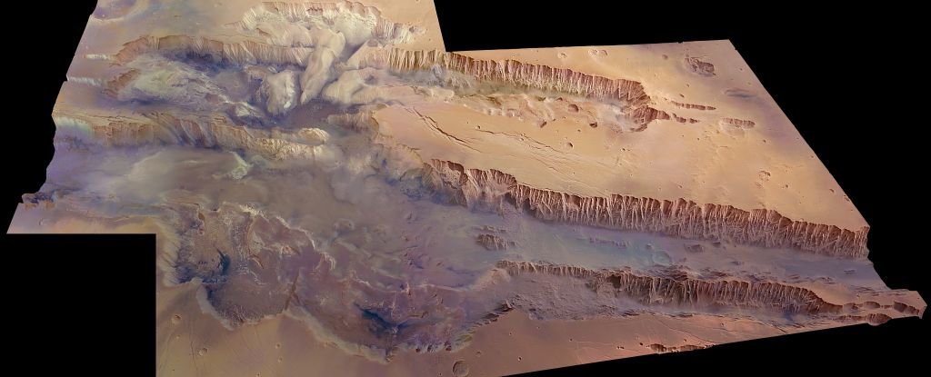 Astronomers Detect Secret Water Reserves in The Largest Canyon in The Solar System